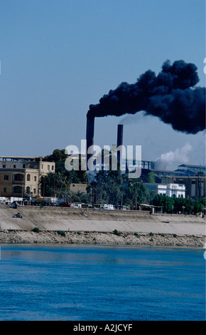 Africa - Egypt - The Nile - Major sugar cane processing plant between Esna & Luxor, black smoke, pollution Stock Photo