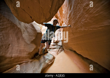 Paul Midkiff canyoneering in Bluejohn canyon, Robbers Roost area, Utah Stock Photo