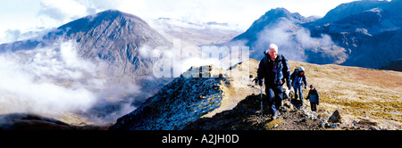 A group of old people,white, European over 60 walking,trekking,rambling through the mountains,hills. Stock Photo