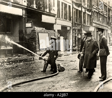 WINSTON CHURCHILL inspects bomb damage on Ludgate Hill, London, after a German air raid in October 1940. See Description below. Stock Photo