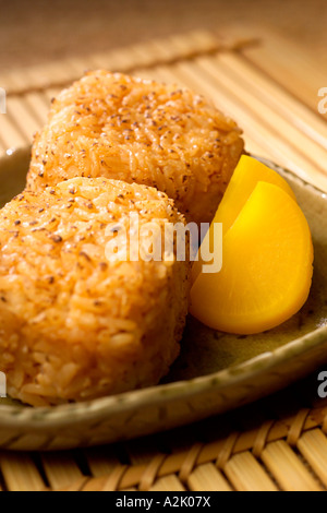 Yaki Onigiri Grilled rice balls served with Japanese pickles Stock Photo