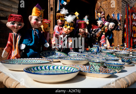 May 17, 2006 - Hand puppets and ceramcis, the traditional souvenirs, are on sale outside a mosque in the Uzbek town of Khiva. Stock Photo