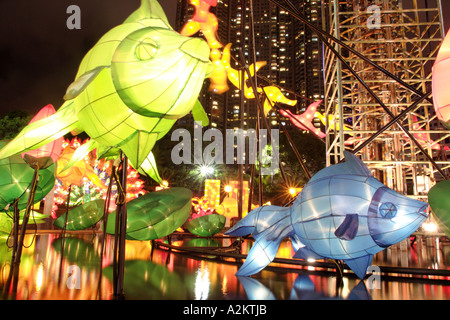 Illuminated lanterns above pond in celebration of Mid Autumn Festival Kowloon Park Tsim Sha Tsui Kowloon Hong Kong Kong SAR Stock Photo