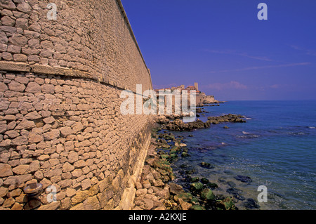 Europe, France, Cote D'Azure, Antibes. Castle walls of old town w/ Church of Immaculate Conception in background Stock Photo