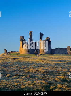 Gatehouse of Dunstanburgh Castle at sunset, Castle Point, near Craster, Northumberland, England, UK. Stock Photo