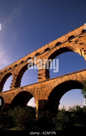EU, France, Provence, Gard, Pont du Gard. Roman aqueduct/bridge in sunset light. Stock Photo