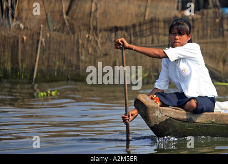 Young Girl in Boat, Kompong Khleang Floating Village, Tonle Sap, Cambodia Stock Photo