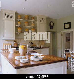 Kitchen with terracotta confit jars in English country house Stock Photo
