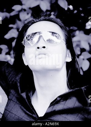 Close-up of young man wearing sunglasses Stock Photo