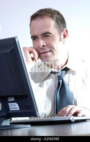 Close-up of businessman working on computer Stock Photo
