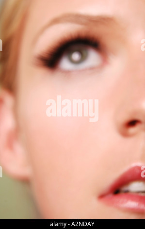 Young woman looking up close-up Stock Photo