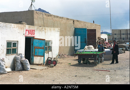 Man and woman playing billiards near guanz (snack bar). Khovd aimak (administrative center). West Mongolia Stock Photo