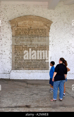 A tourist family reads about the history Panama at Las Bovedas, Plaza de Fancia, Old Quarter, Panama City Republic of Panama Stock Photo