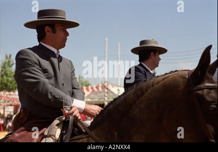 Seville, Andalusia, Spain. Feria de Abril, horse riders Stock Photo
