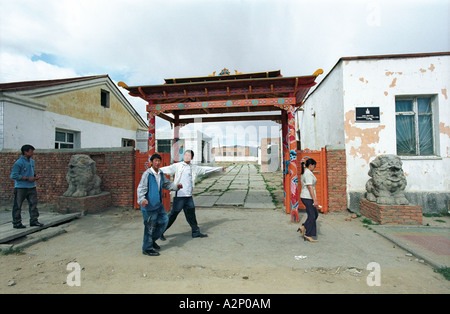 Young people walking the street near Buddhist temple. Khovd aimak (administrative center). West Mongolia Stock Photo