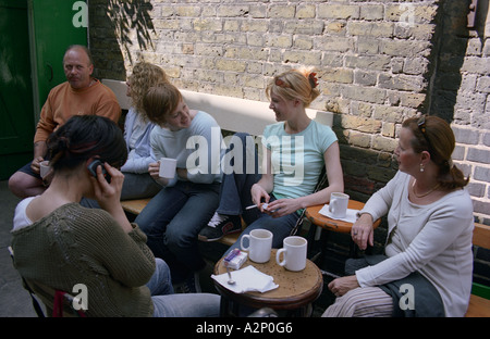 United Kingdom, England, London Outdoor cafe at Columbia Road flower market. Summer Stock Photo
