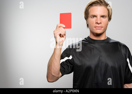 Referee holding red card Stock Photo