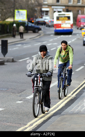 Cyclists in cycle lane, High Street, Oxford, Oxfordshire, England, UK Stock Photo
