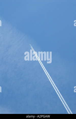 High flying jet and exhaust flying high over New York City Stock Photo