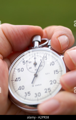 Stopwatch in hand close up Stock Photo