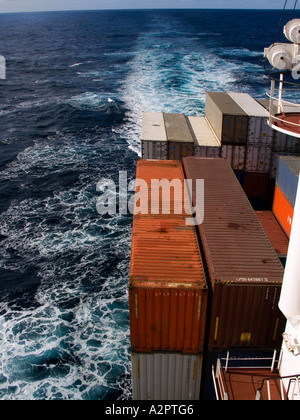 Wash behind container vessel at sea. Stock Photo