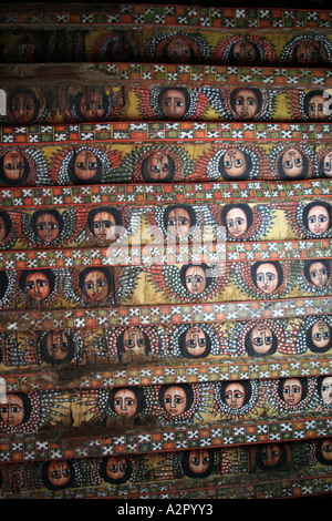 Angels painted in the Ethiopian Orthodox style, adorn the ceiling of ...