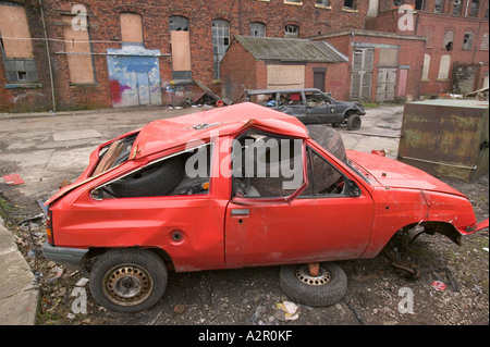 abandoned cars in a run down area of Barrow in Furness Cumbria