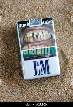 Smoking warning on a cigarette pack in Thailand. Stock Photo