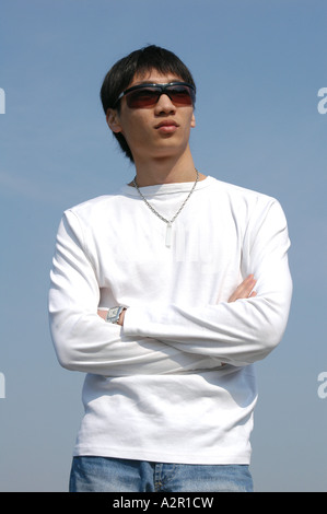 Young Asian man in sunglasses Stock Photo