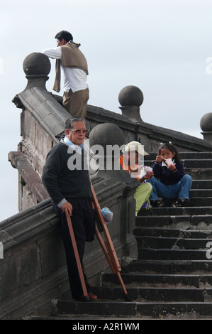 One-legged invalid on the staircase of San Francisco Monastery on Plaza San Francisco in Quito, Ecuador Stock Photo