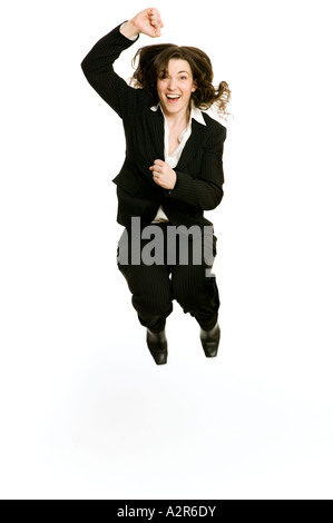 business woman jumping high in the air to celebrate success Stock Photo