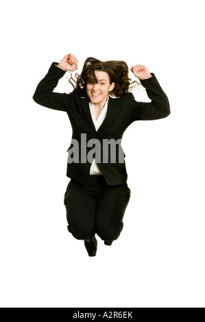 business woman jumping high in the air to celebrate success Stock Photo