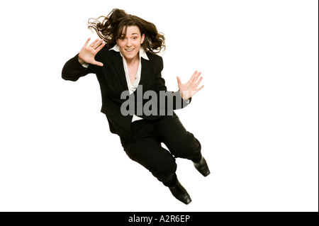 business woman jumping high in the air to celebrate success Stock Photo