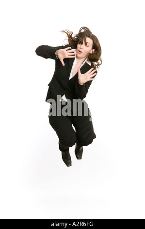 business woman jumping high in the air to celebrate success Stock Photo