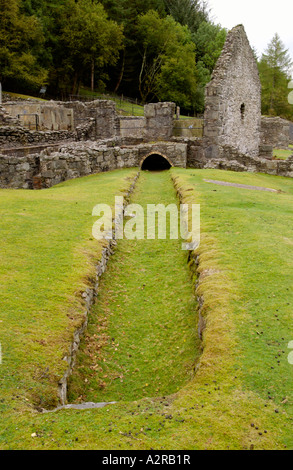 Remains of 19th century Bryntail Lead Mine below dam of Clywedog reservoir Powys Mid Wales UK Stock Photo