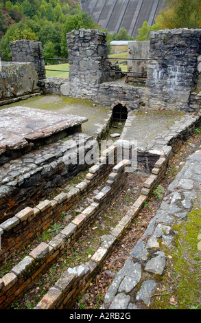 Remains of 19th century Bryntail Lead Mine below dam of Clywedog reservoir Powys Mid Wales UK Stock Photo