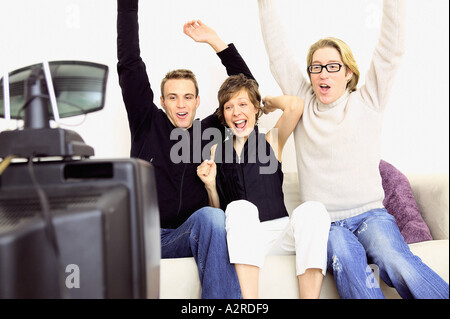 People celebrating on sofa Stock Photo