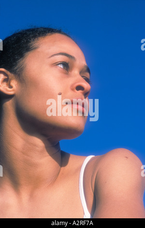 Portrait of mixed Caucasian African American female looking to side Stock Photo