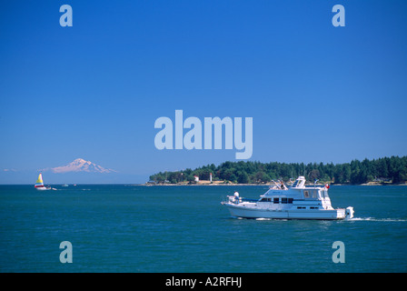 Southern Gulf Islands, BC, British Columbia, Canada - Boating in Active Pass past Mayne Island and Mt Baker, USA in distance Stock Photo