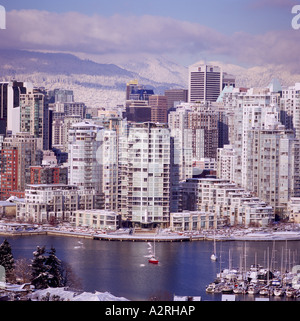 The City of Vancouver Skyline at 'False Creek' and the 'North Shore' Mountains British Columbia Canada in Winter Stock Photo