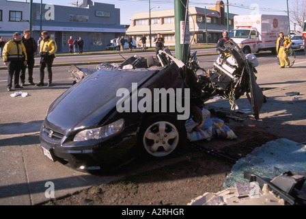 Police investigate Fatal Car Crash Traffic Accident Scene of Speeding Teenage Driver into Pole Vancouver British Columbia Canada Stock Photo