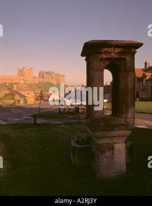 Bamburgh Castle seen from Bamburgh village at sunset, Northumberland, England, UK. Stock Photo