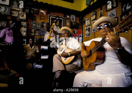Band of elderly men playing music in Casa de la Trova, a bar in Santiago, Cuba Stock Photo
