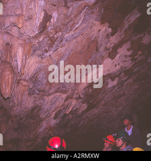 Tourist Spelunkers explore  Riverbend Cave at Horne Lake Caves Provincial Park on Vancouver Island  British Columbia Canada Stock Photo