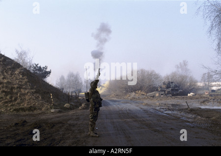 nato exercises in berlin us troops exercise in dough boy city soldier firing flare gun  Germany Stock Photo