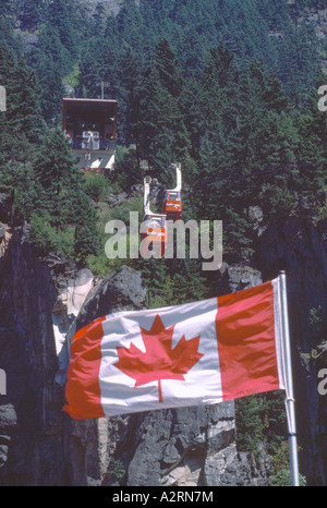 Hell's Gate Airtram / Cable Cars in the Fraser Canyon, BC, British Columbia, Canada - Canadian Flag with Maple Leaf Stock Photo