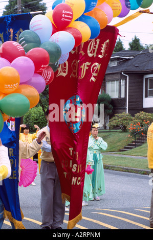 Falun Gong aka Falun Dafa Practitioners marching in Peaceful Parade, Vancouver, BC, British Columbia, Canada Stock Photo