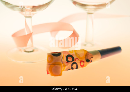 Wine Glasses with Party Blower Stock Photo