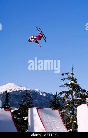 A Skier competing in a Free-Style Ski Competition on Blackcomb Mountain Whistler British Columbia Canada Stock Photo