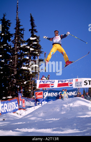 A Skier competing in a Free-Style Ski Competition on Blackcomb Mountain Whistler British Columbia Canada Stock Photo